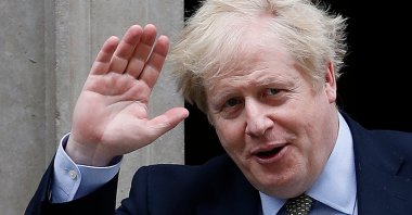 Britain's Prime Minister Boris Johnson leaves 10 Downing Street in Central London, March 18, 2020. (AFP Photo)