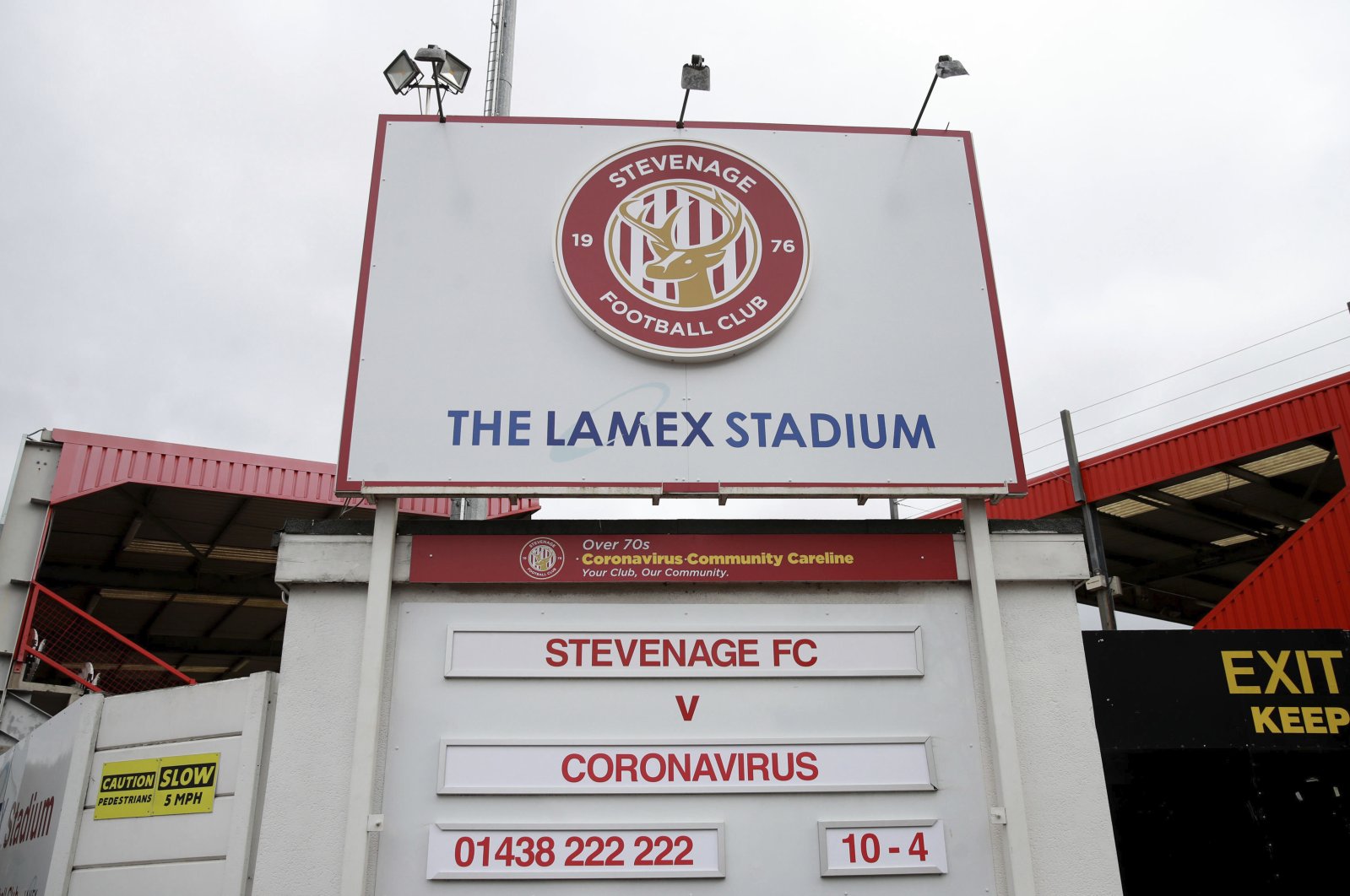 The Lamex Stadium, home of Stevenage football club, where the upcoming fixture board shows Stevenage FC v Coronavirus, Sunday, March 29, 2020. (AP Photo) 