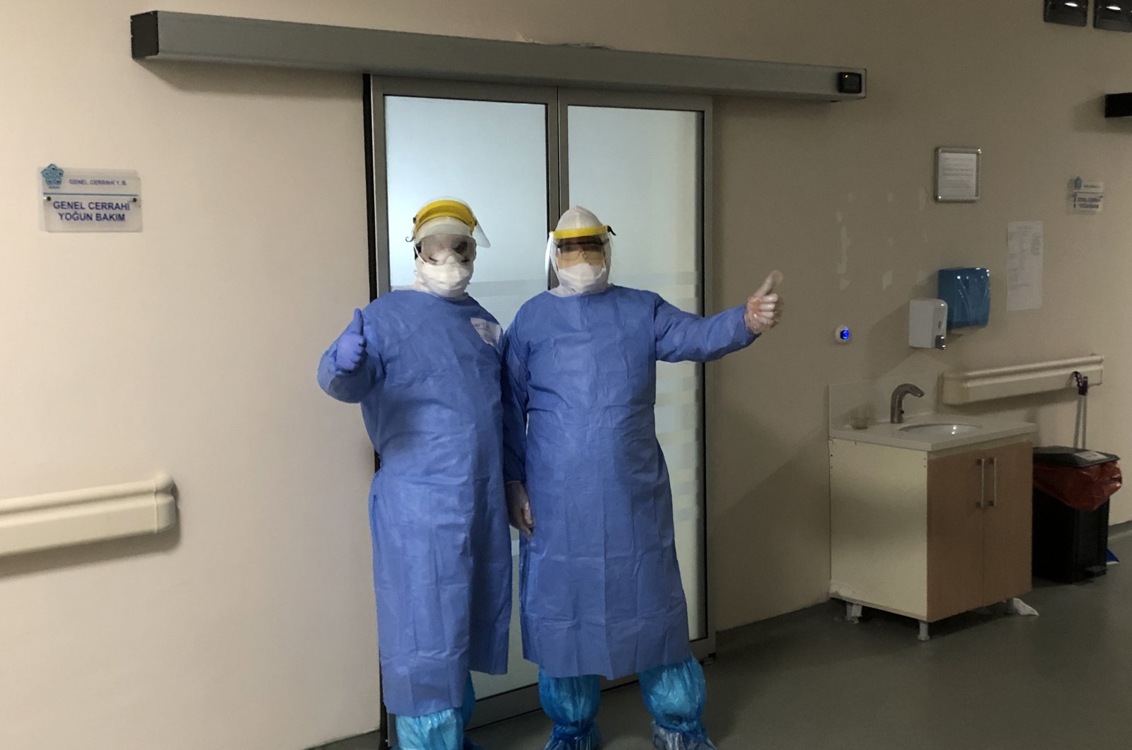 Health care staff wearing protective gearing pose outside an intensive care unit, Konya, Turkey, April 11, 2020. (PHOTO BY HALİT TURAN)