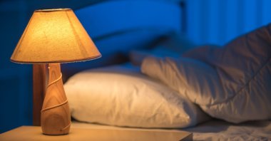 An earlier bedtime could help us shrink our carbon footprint. (iStock Photo)