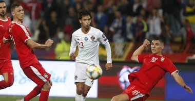 Portugal's Joao Felix, center, kicks the ball ahead of Serbia's Nemanja Matic, left, and Serbia's Nikola Milenkovic during the Euro 2020 group B qualifying match between in Belgrade, Serbia, Sept. 7, 2019. (AP Photo)