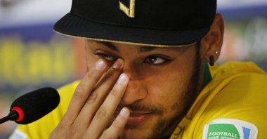 Then-injured Brazilian national football team player Neymar Jr. cries during a news conference in Teresopolis, near Rio de Janeiro, Brazil, July 10, 2014. (AP Photo)