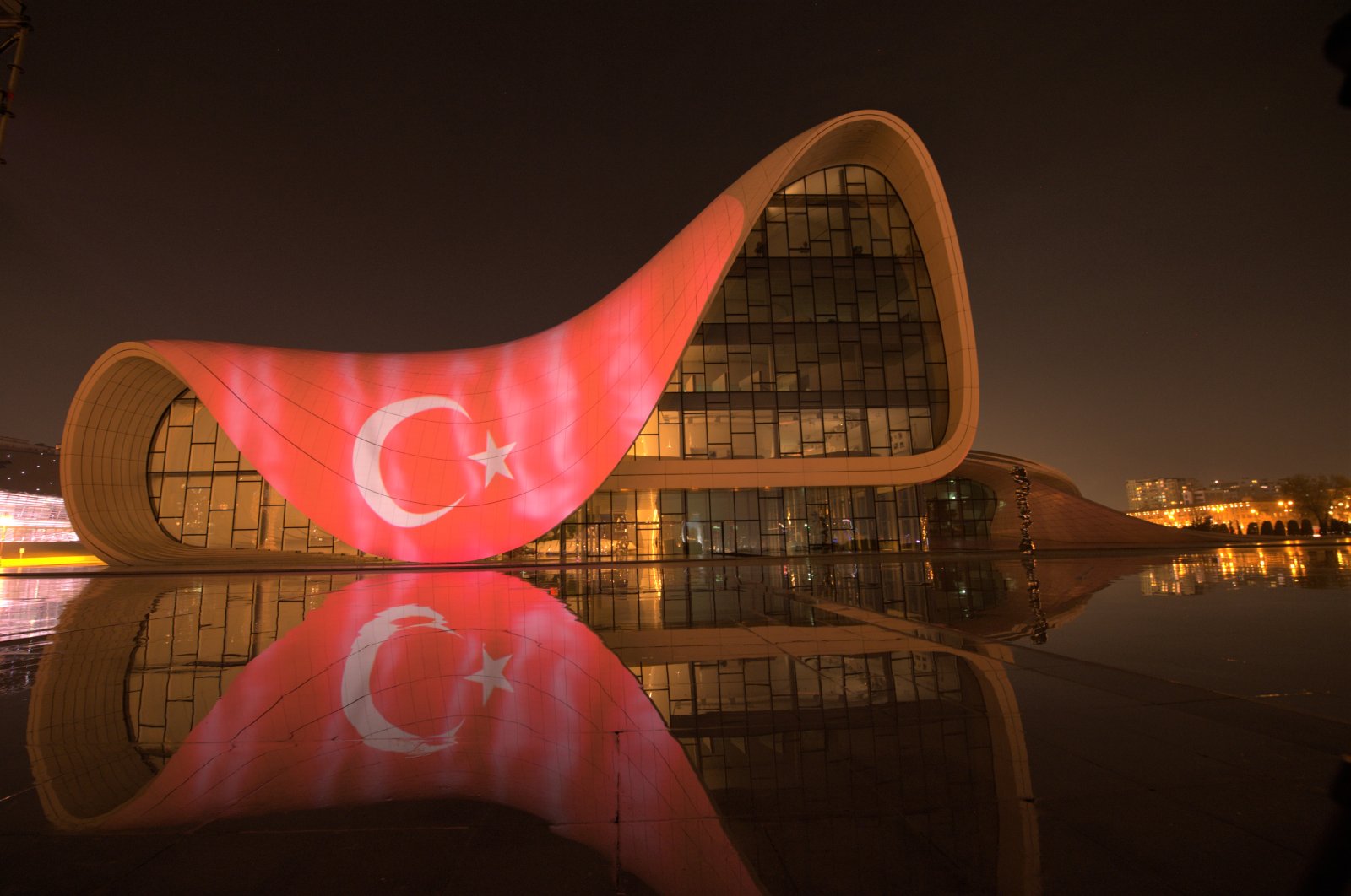 Azerbaijan displayed a digital version of the Turkish flag at the Heydar Aliyev Cultural Center, an iconic symbol in the capital Baku, in a show of solidarity amid the coronavirus pandemic, April 11, 2020. (AA Photo)
