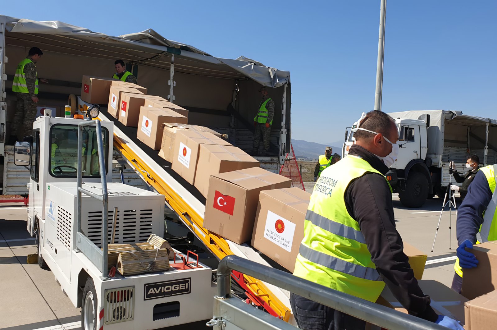 Serbian officials unload Personal Protection Equipment donated by Turkey to help the country combat the new coronavirus outbreak, in Belgrade, Serbia, Wednesday, April 8, 2020. (AP Photo)