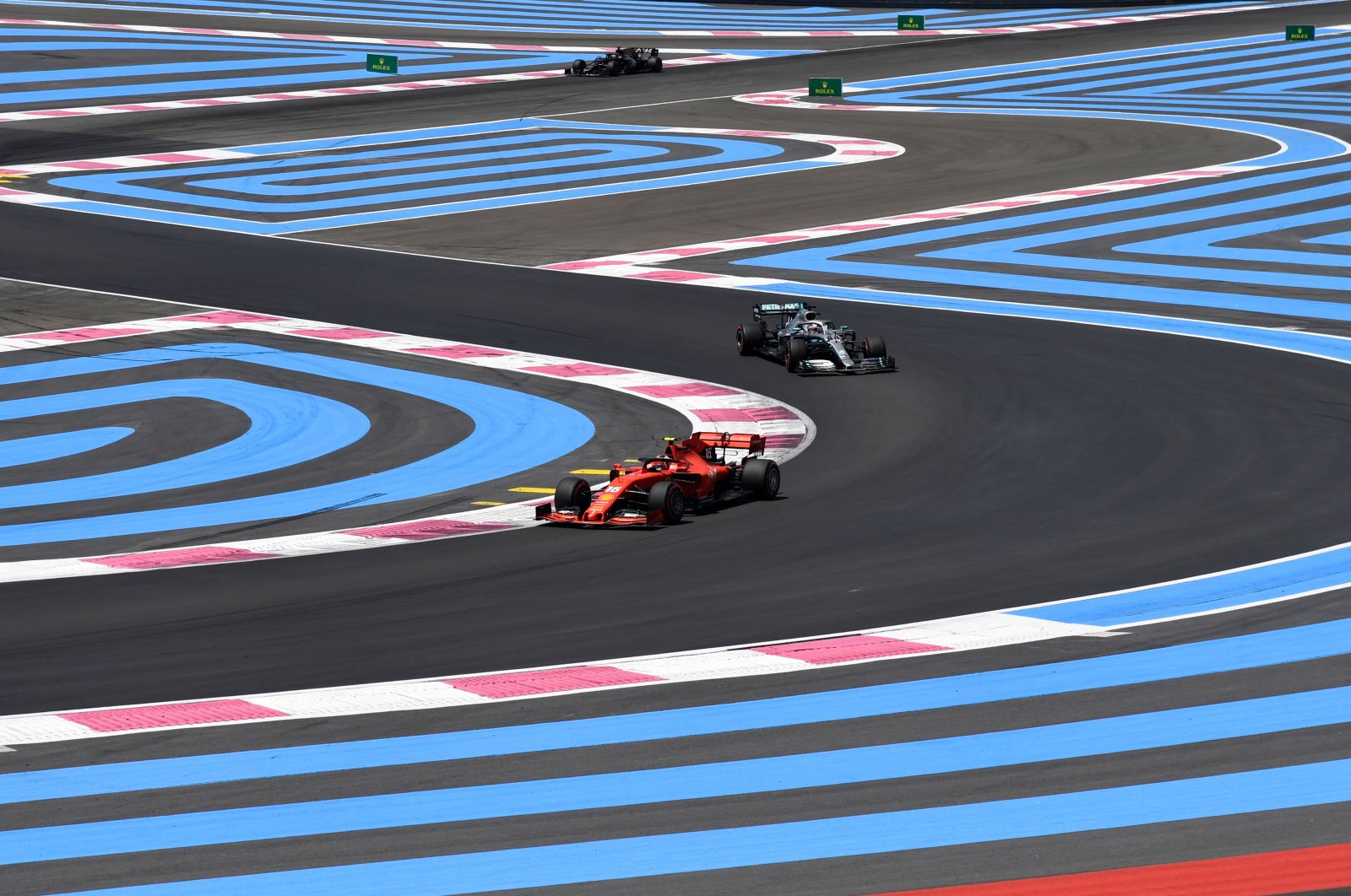Ferrari's Charles Leclerc drives ahead of Mercedes' Lewis Hamilton during the third practice session at the Circuit Paul Ricard in Le Castellet, June 22, 2019. (AFP Photo)