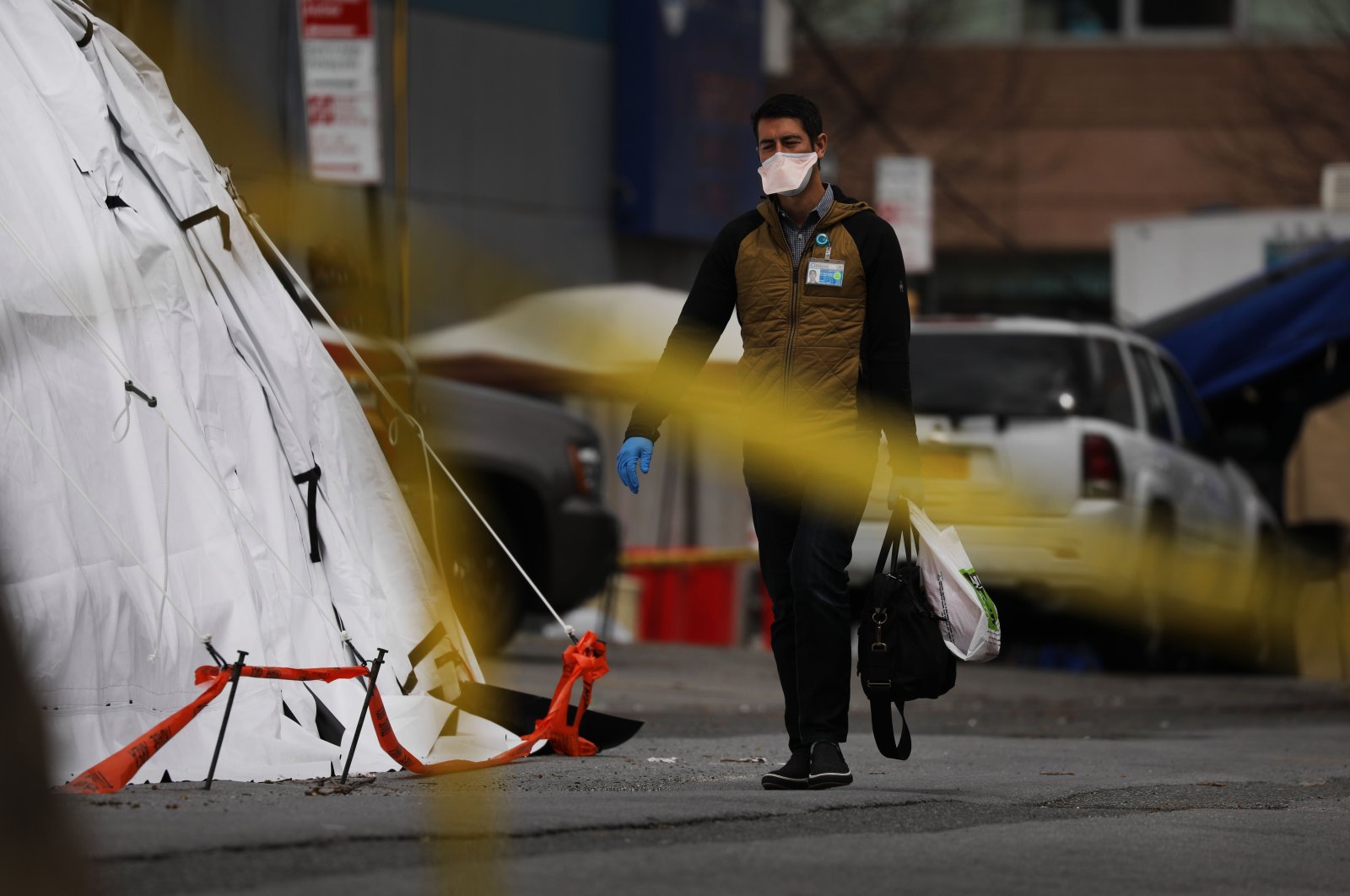Medical workers walk outside of a coronavirus intake tent at the University Hospital of Brooklyn on April 14, 2020 in New York City, United States. (AFP Photo)