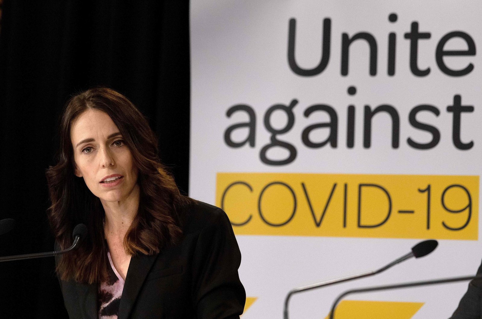 New Zealand's Prime Minister Jacinda Ardern speaks to the media during a press conference one day before the country goes on lockdown to stop any progress of the COVID-19 coronavirus, at Parliament in Wellington on March 24, 2020. (AFP Photo)