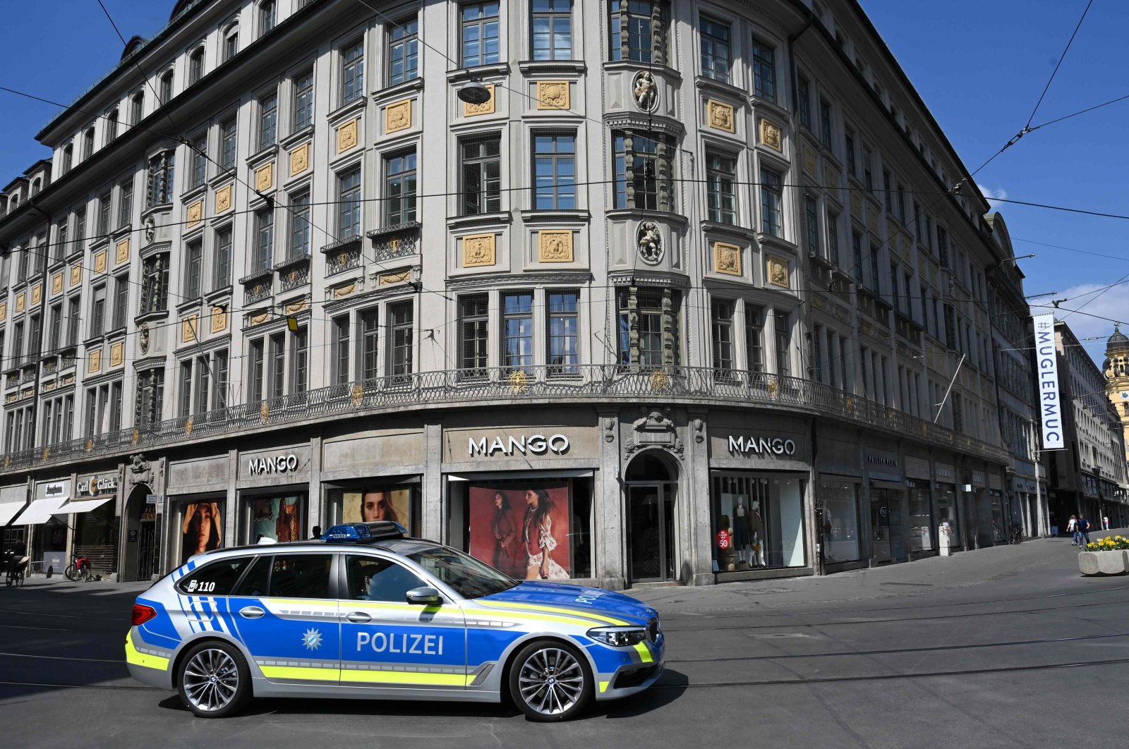 A police car patrols empty streets in the center of Munich as public life in Bavaria has been limited due to the spread of the coronavirus, southern Germany, April 9, 2020. (AFP Photo)