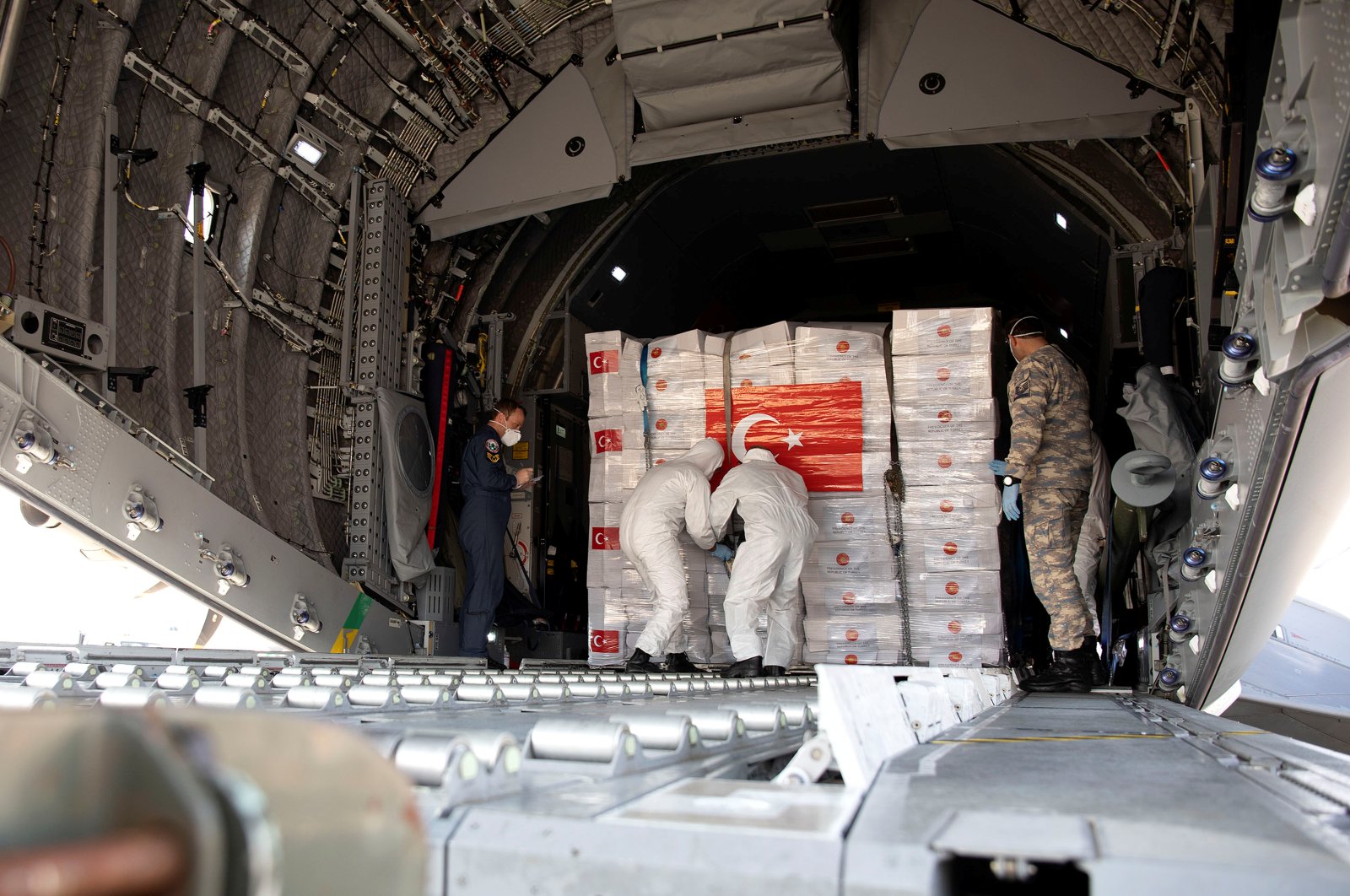 Crucial supplies of personal protective equipment (PPE) for medical staff are delivered from Turkey into a Royal Air Force base for distribution around the country, amid the coronavirus disease (COVID-19) outbreak, in Carterton, Britain, April 10, 2020. (Reuters Photo)