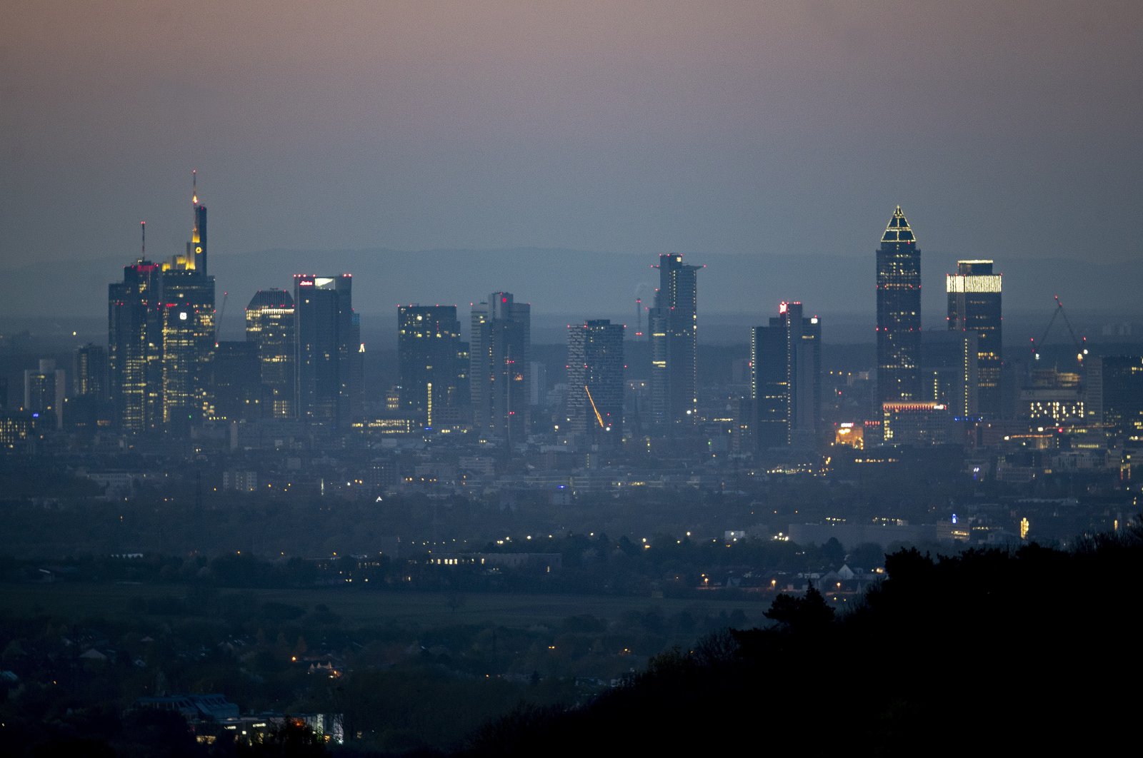 The buildings of the banking district in Frankfurt against an early morning skyline, Germany, April 14, 2020. (AP Photo)