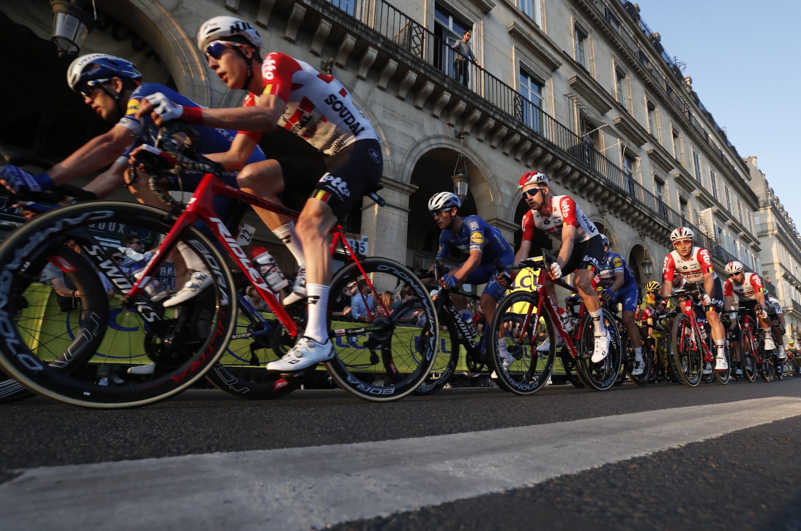 The pack cycles through the streets of Paris during the 21st stage of the Tour de France cycling race in Paris, France, July 28, 2019. (AP Photo)