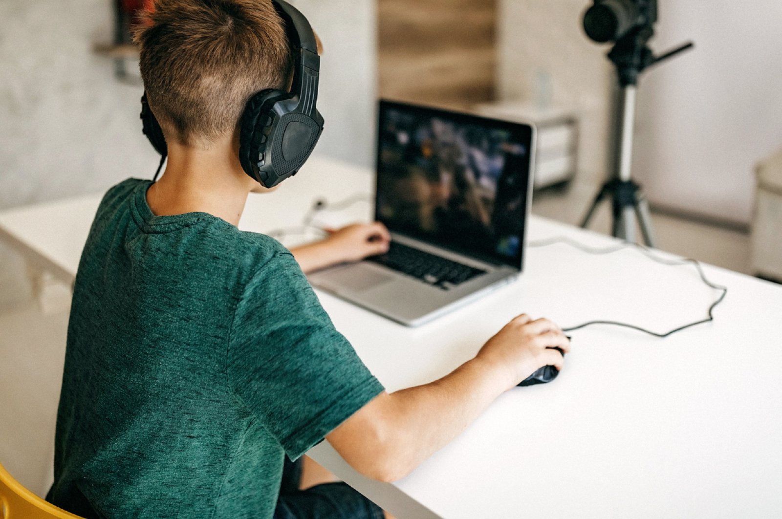 A child plays a game while recording his gameplay. (iStock Photo)
