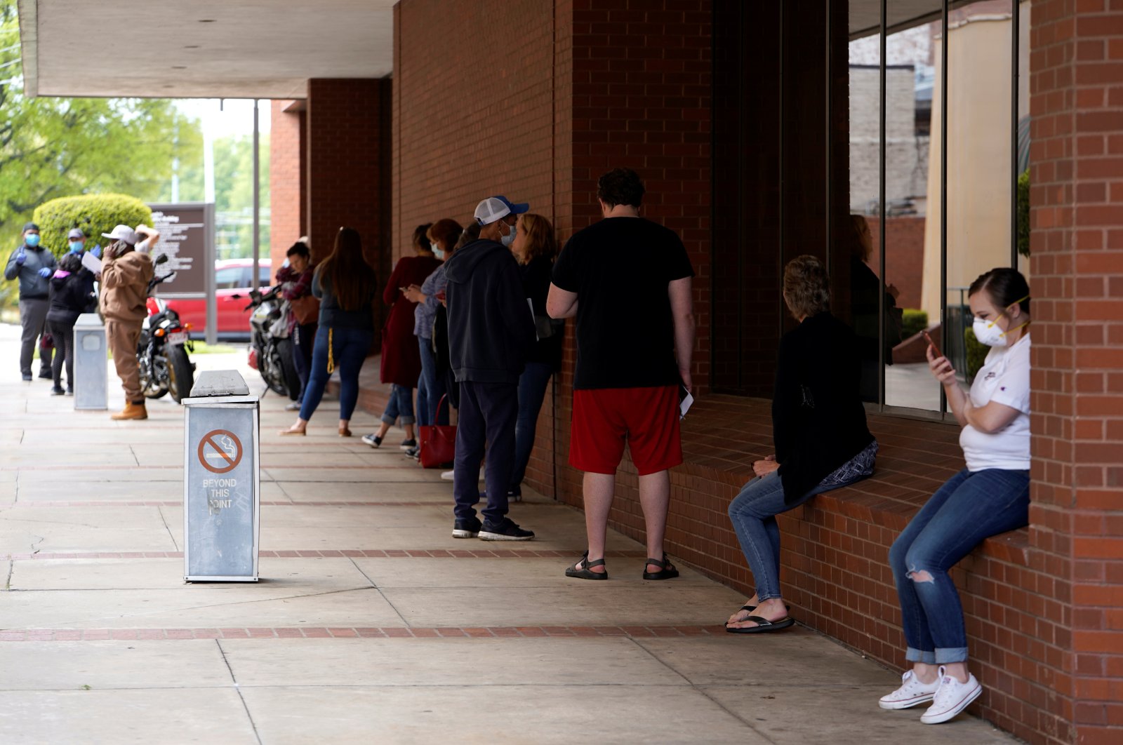 People who lost their jobs wait in line to file for unemployment following an outbreak of the coronavirus, at an Arkansas Workforce Center in Fort Smith, Arkansas, U.S., April 6, 2020. (Reuters Photo)