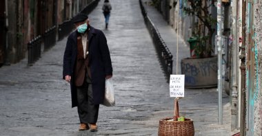 A basket hung up so people can donate or take for free food is seen, as Italy struggles to contain the spread of coronavirus disease (COVID-19), in Naples, Italy March 30, 2020.(Reuters Photo)