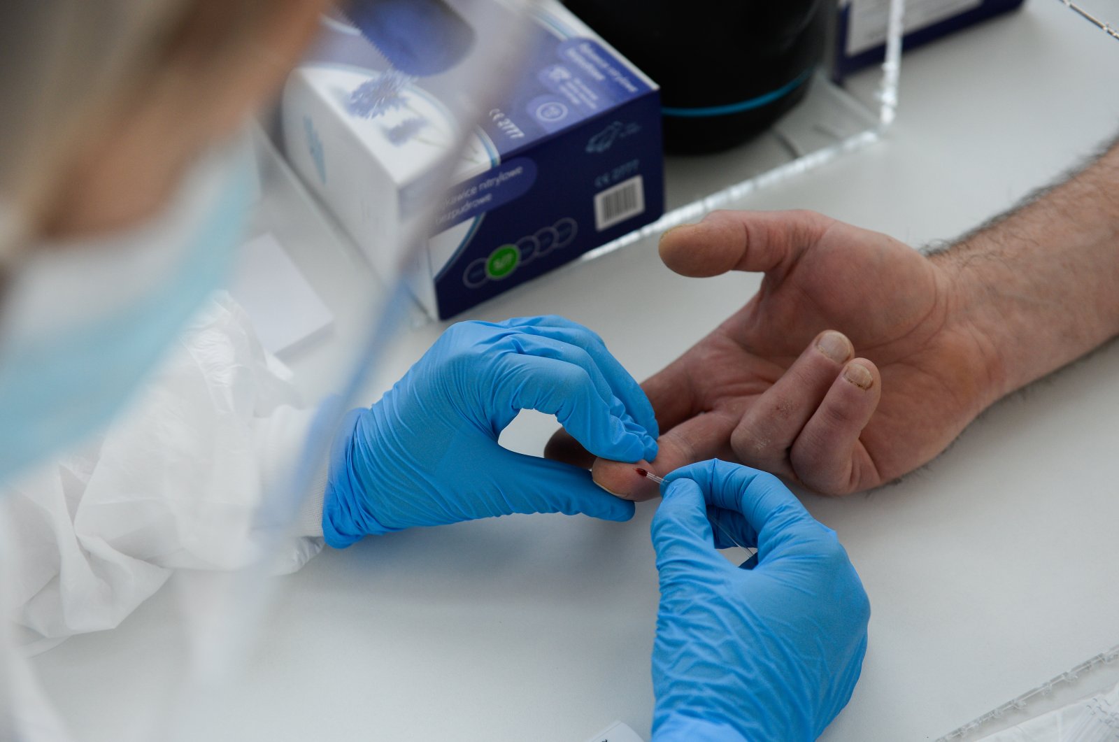 A medical staff member administers a coronavirus antibody test at Dworska hospital in Krakow, Poland, April 16, 2020. (AA Photo)