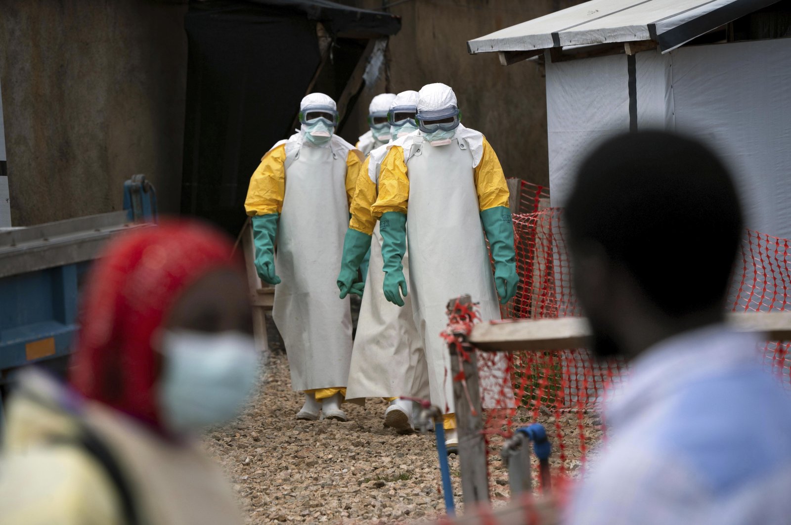 In this Tuesday, July 16, 2019 photo, health workers wearing protective gear begin their shift at an Ebola treatment center in Beni, Congo. (AP Photo)