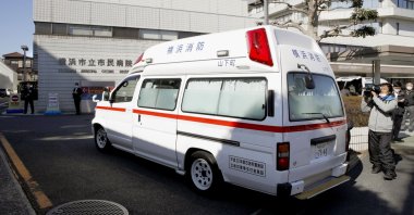 In this Feb. 5, 2020, photo, an ambulance carrying a passenger onboard cruise ship Diamond Princess arrives at a hospital in Yokohama, near Tokyo. (Kyodo News via AP)