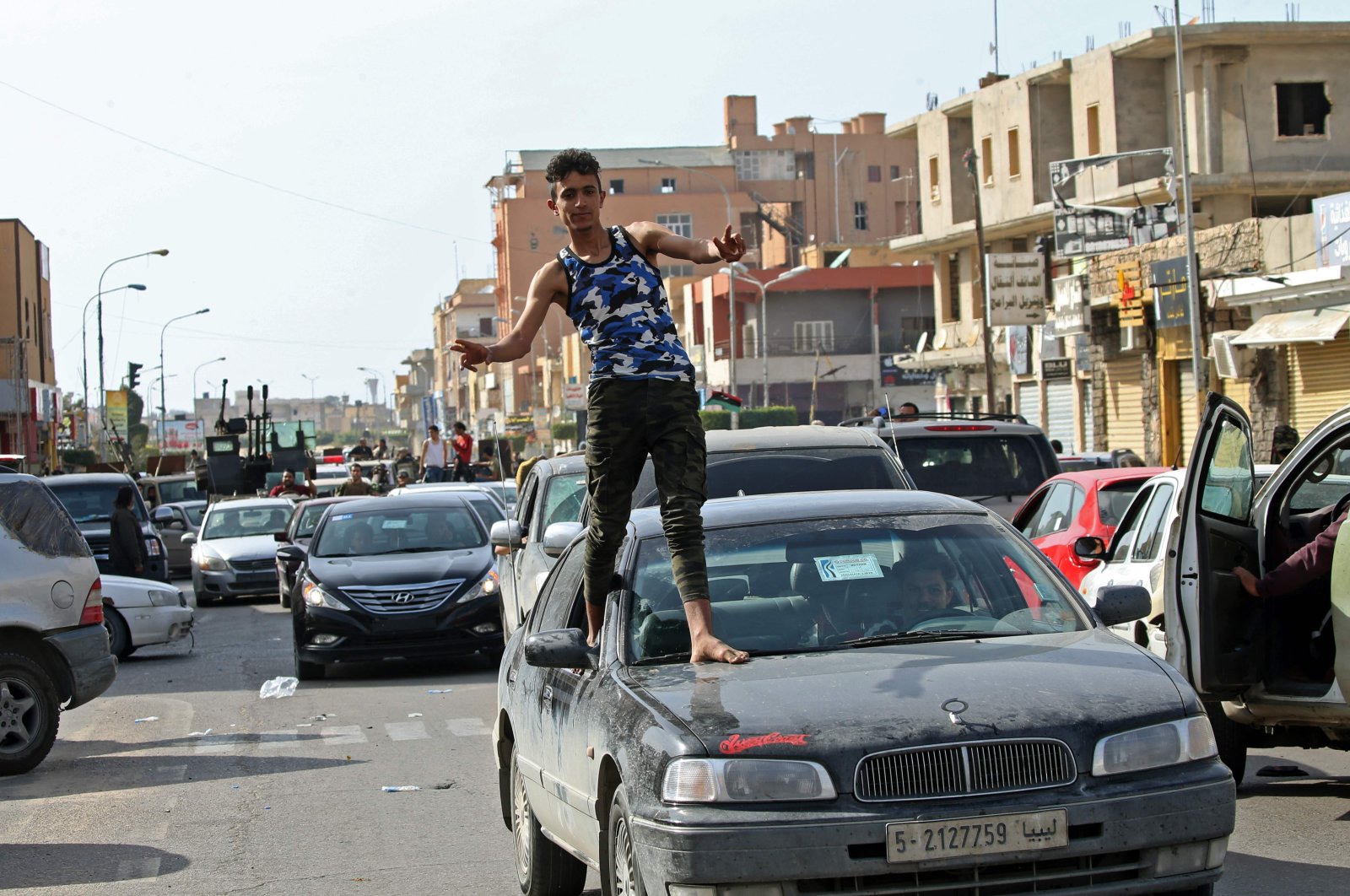A Libyan man gestures in celebration as fighters loyal to the UN-recognized Government of National Accord (GNA) drove into the coastal city of Sabratha after it seized two coastal cities between Tripoli and the Tunisian border from troops backing Khalifa Haftar, Sabratha, Libya, April 13, 2020. (AFP Photo)