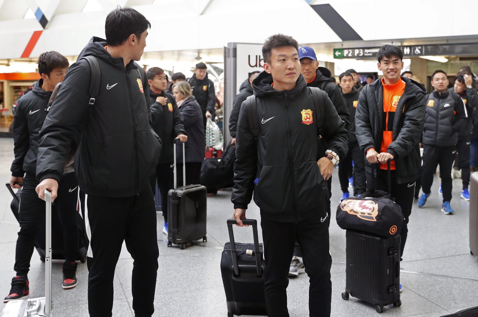 Players of the Chinese Super League team Wuhan Zall arrive at the Atocha train station in Madrid, Spain, Saturday, Feb. 29, 2020. (AP Photo)