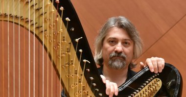 Çağatay Akyol poses with his harp in this undated photo.