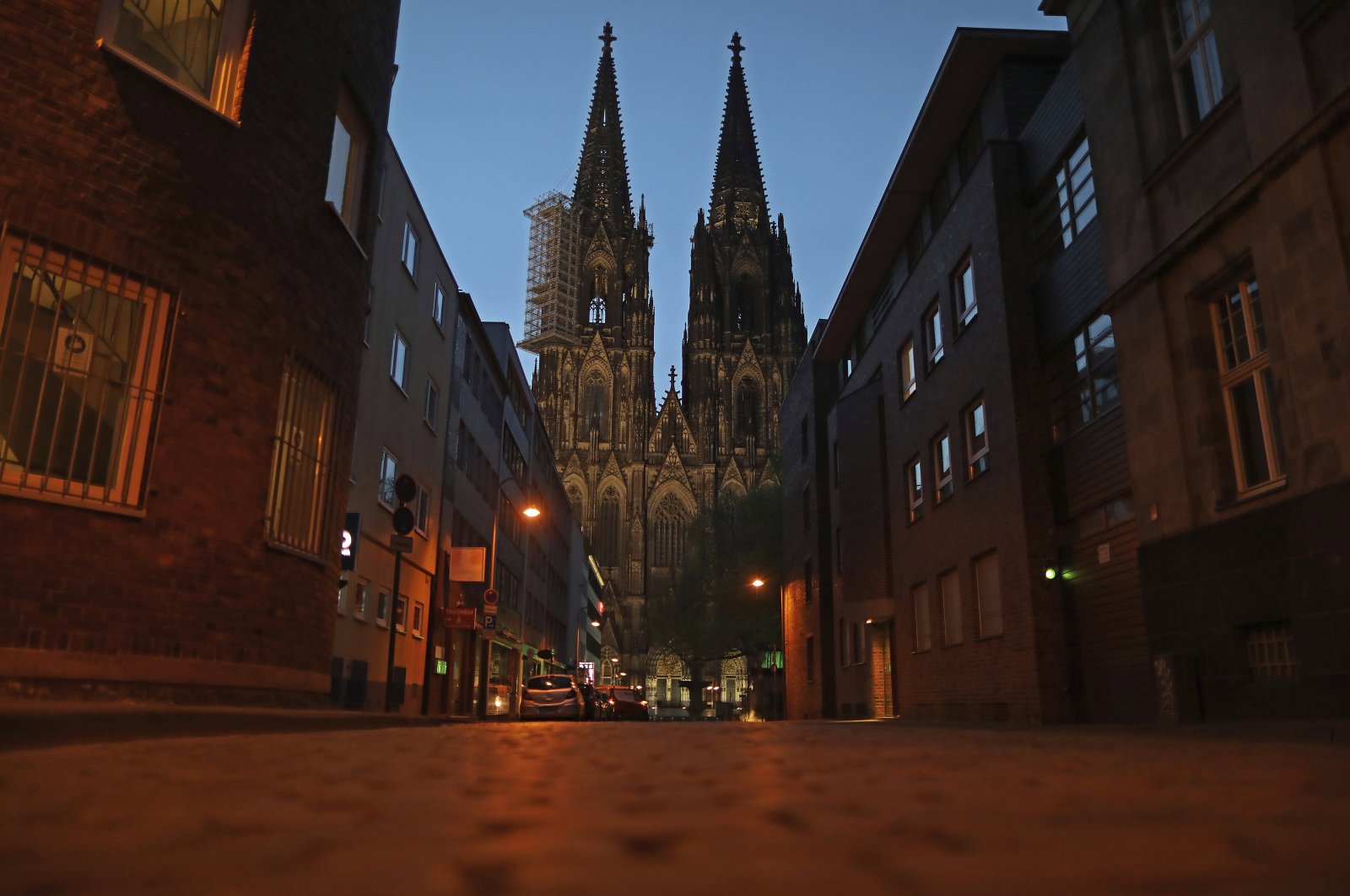 An alley by the cathedral is deserted in Cologne, North Rhine-Westphalia, Germany, April 15, 2020. (AP Photo)