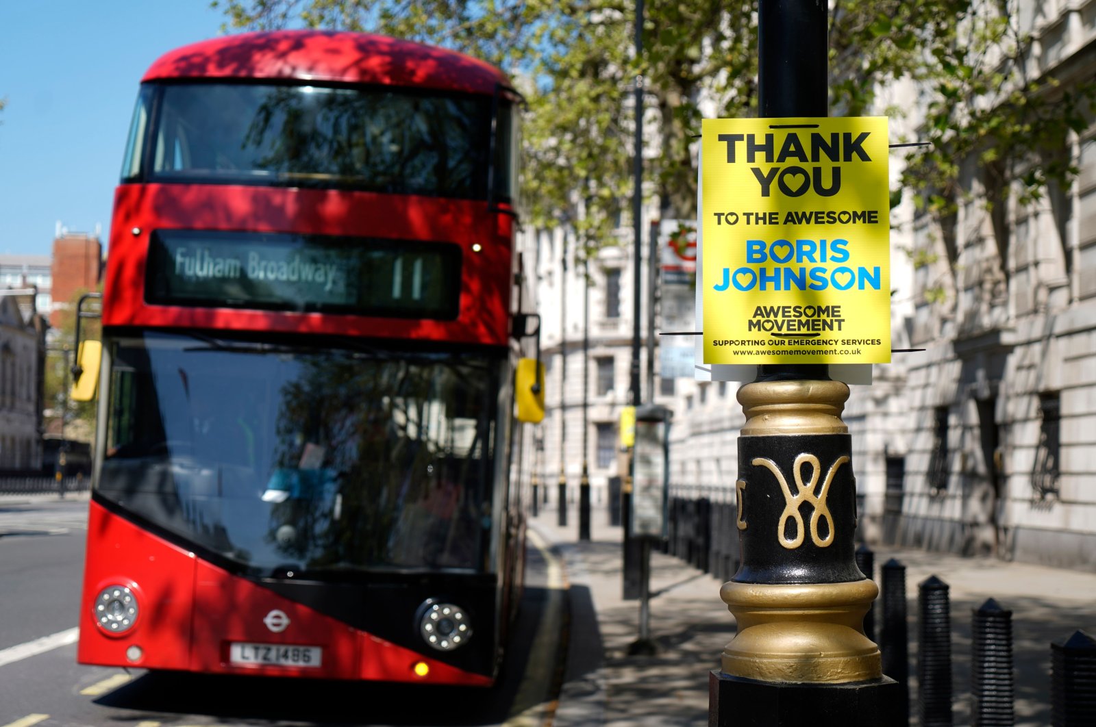 A sign in support of Britain's Prime Minister Boris Johnson is attached to a lamp post in central London, April 20, 2020. (AFP Photo)
