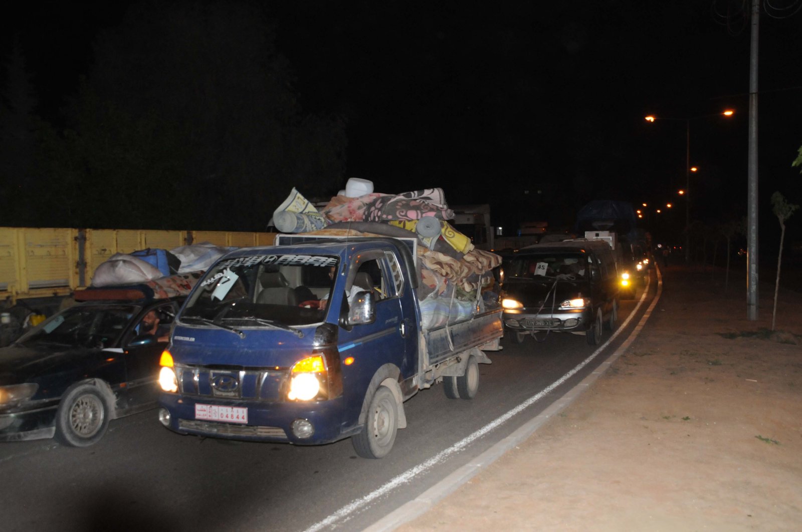 Some 150 vehicles carrying displaced Syrian families moved from Afrin to Tal Abyad, April 20, 2020. (DHA) 