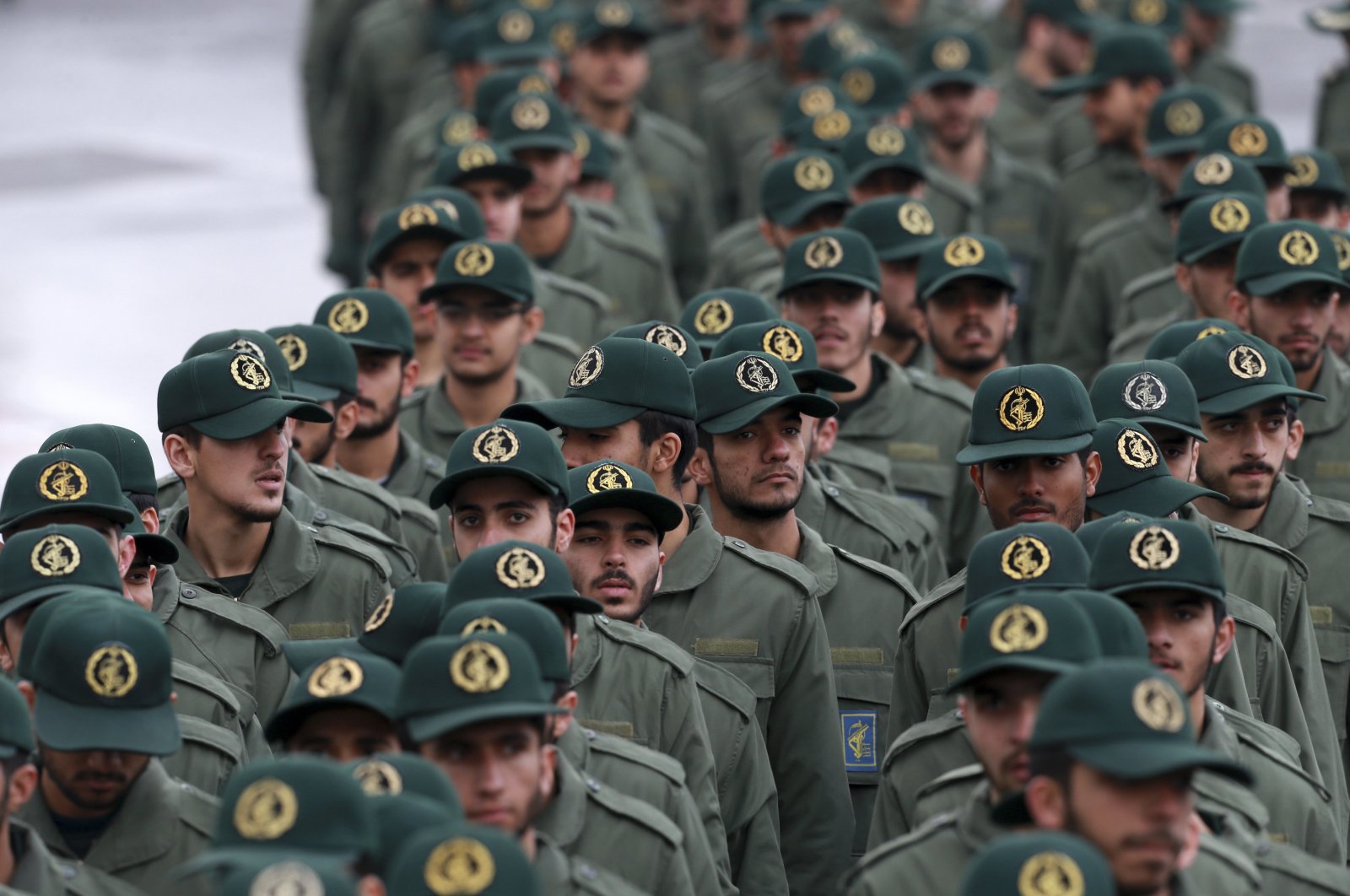 In this Feb, 11, 2019 file photo, Iranian Revolutionary Guard members arrive for a ceremony celebrating the 40th anniversary of the Islamic Revolution, at the Azadi, or Freedom, Square, in Tehran, Iran. (AP Photo)