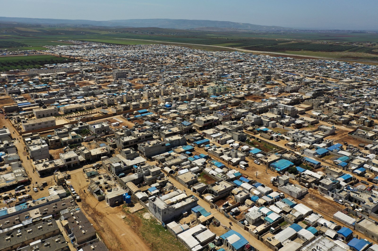A large refugee camp on the Syrian side of the border with Turkey, near the town of Atma, in Idlib province, Syria, April 19, 2020. (AP Photo)