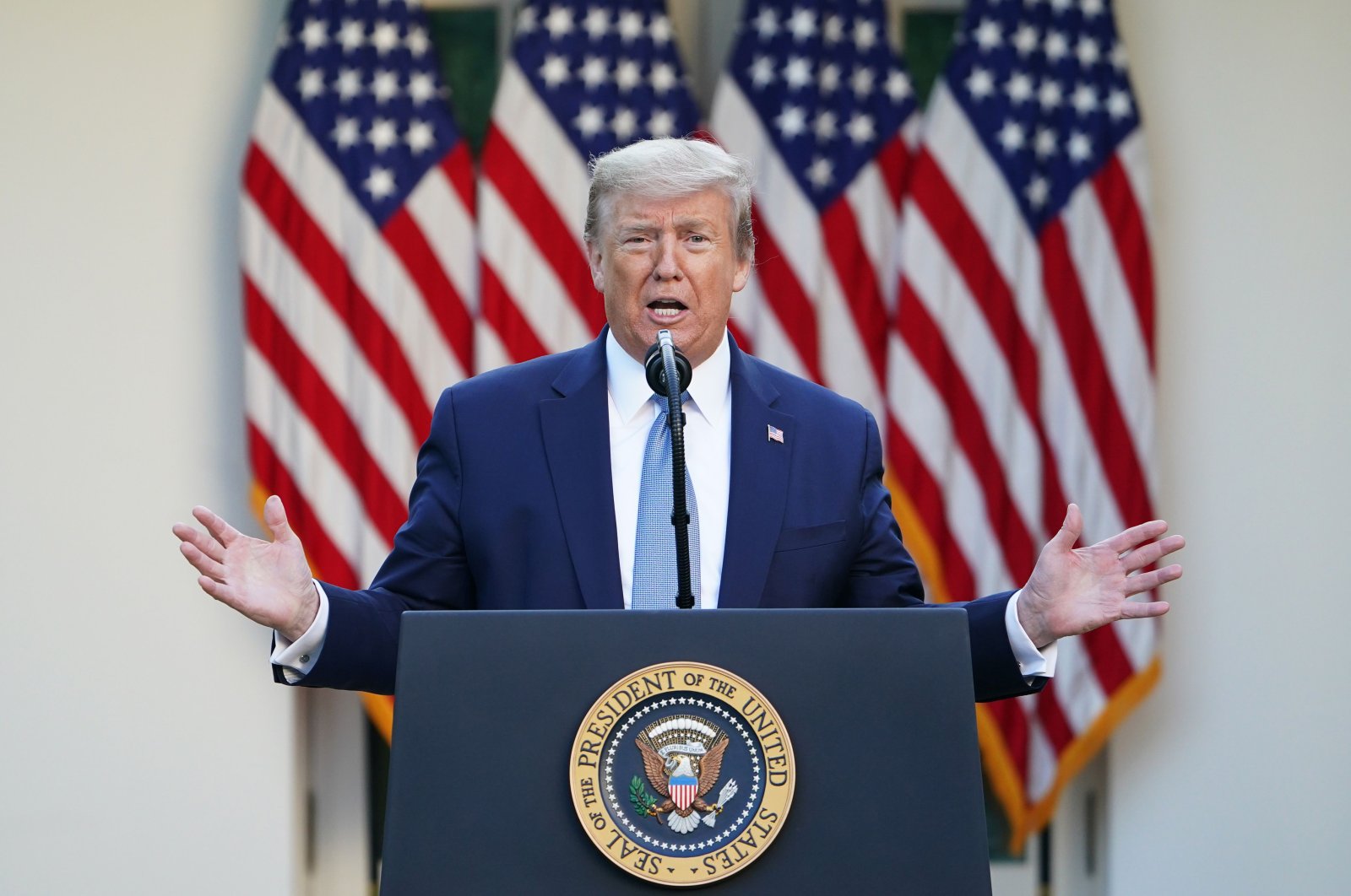 U.S. President Donald Trump gestures as he speaks during the daily briefing on the novel coronavirus in the Rose Garden of the White House, in Washington, D.C., U.S., April 15, 2020. (AFP Photo)
