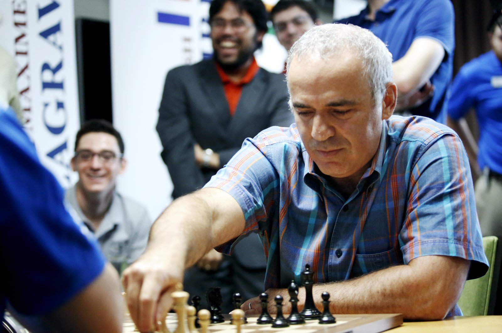 World chess legend Garry Kasparov makes a move during a series of rapid and blitz exhibition games called Ultimate Moves, St. Louis, Missouri, United States, Sept. 3, 2015. (AP Photo)