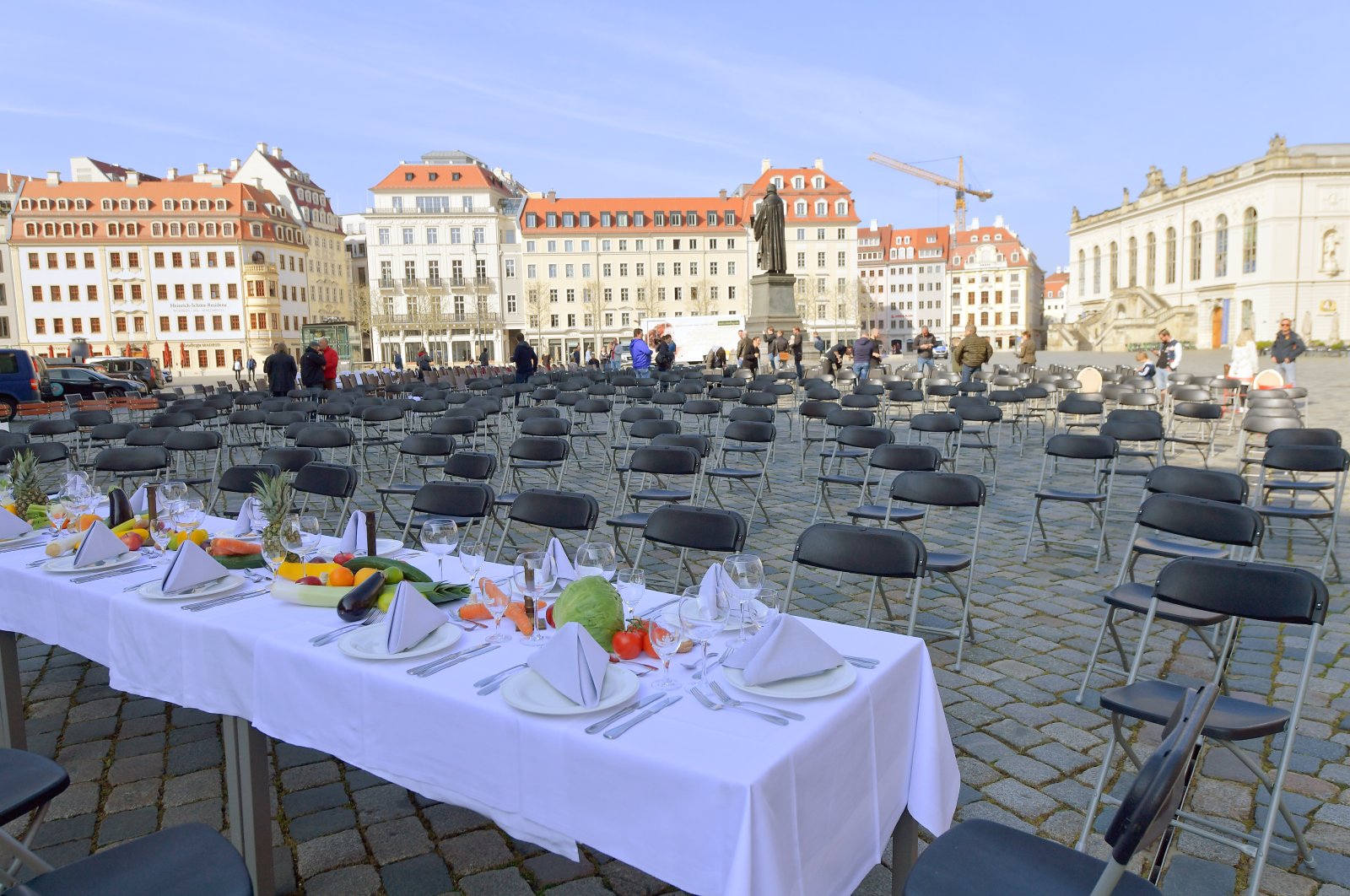 Empty chairs and decorated tables are set up in Neumarkt square to call attention to the difficult situation of hotel and restaurant owners as the spread of the coronavirus continues, Dresden, Germany, April 17, 2020. (Reuters Photo)