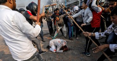 A group of men chanting pro-Hindu slogans beat Mohammad Zubair, 37, who is Muslim, during protests sparked by a new citizenship law in New Delhi, Feb. 24, 2020. (Reuters Photo) 