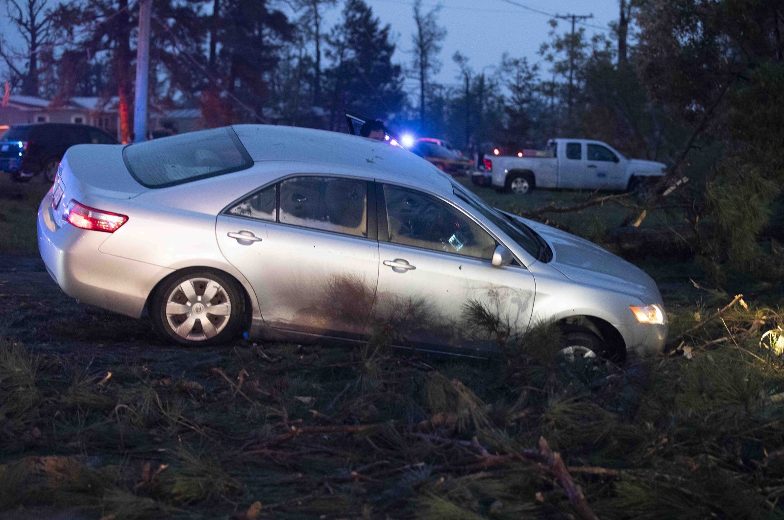 A car is seen in a ditch in Onalaska, Texas, after a tornado touched down in the area Wednesday, April 22, 2020. (AP Photo)