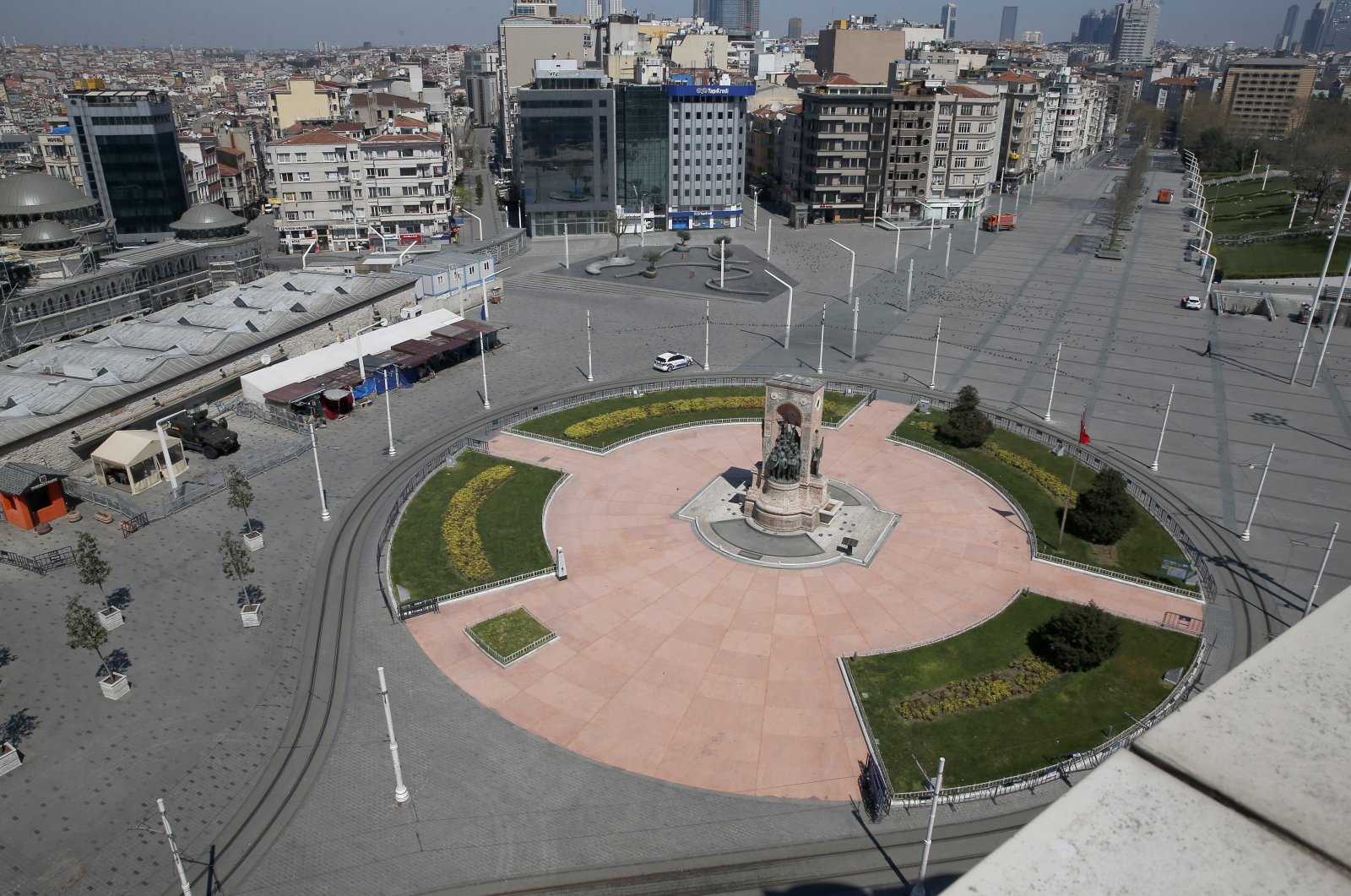 Istanbul's iconic Taksim Square was left deserted as the government declared a curfew over the weekend, Istanbul, Turkey, April 18, 2020. (AP Photo)