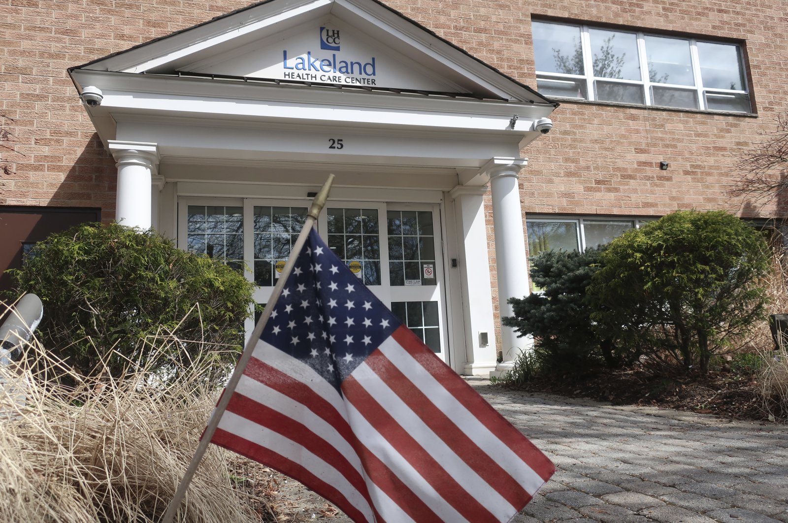 This Wednesday, April 1, 2020, file photo, shows an entrance to the Lakeland Health Care Center, a nursing home in Wanaque, N.J. Multiple people at the facility have died of COVID-19, the disease caused by the new coronavirus, according to the borough's Mayor Dan Mahler. (AP Photo)