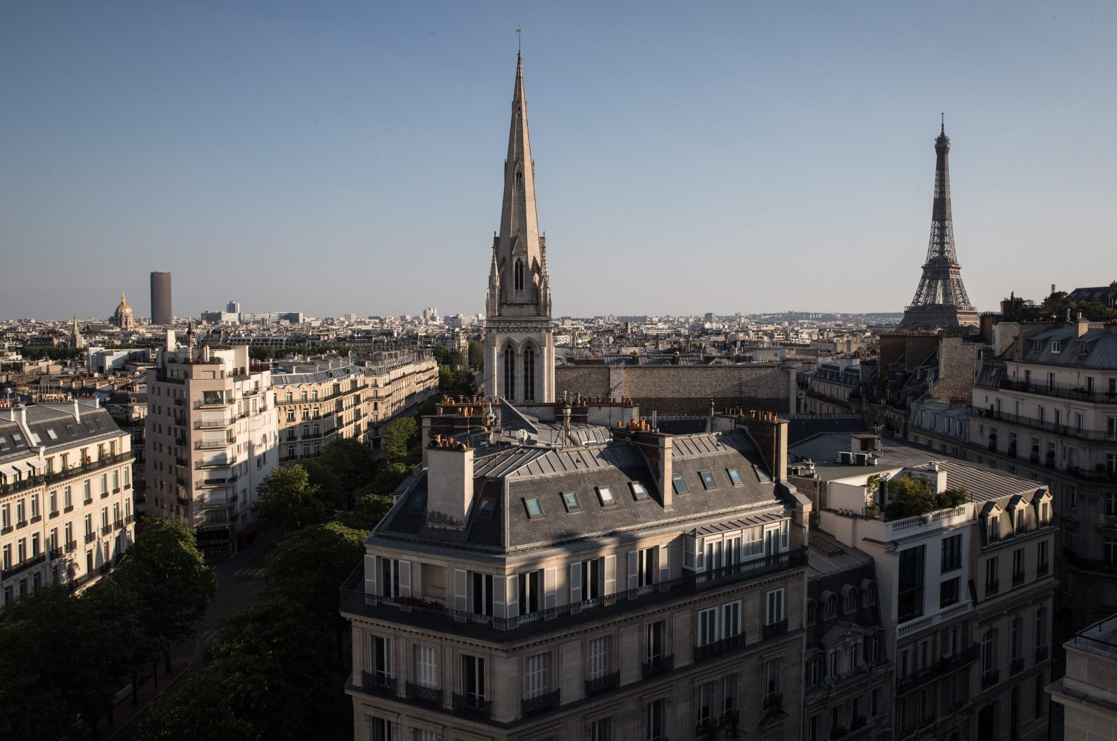 This picture, taken on April 23, 2020, shows (From L) The Invalides, the Montparnasse tower, the American Cathedral and the Eiffel Tower, in Paris, on the 38th day of a lockdown in France aimed at curbing the spread of the COVID-19 disease, caused by the novel coronavirus. (AFP Photo)
