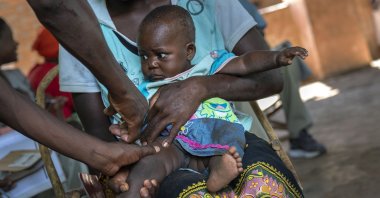 A baby from the Malawi village of Tomali is injected with the world's first vaccine against malaria in a pilot program, Dec. 11, 2019. (AP Photo)