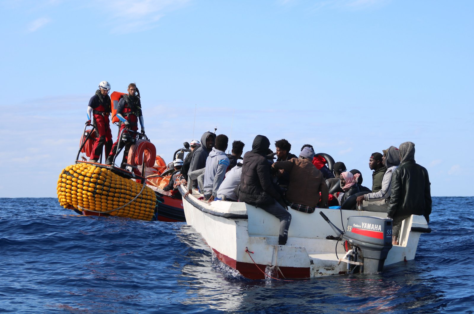 SOS Mediterranee team members from the humanitarian ship Ocean Viking approach a boat in distress with 30 people on board in the waters off Libya, Nov. 20, 2019. (AP Photo)