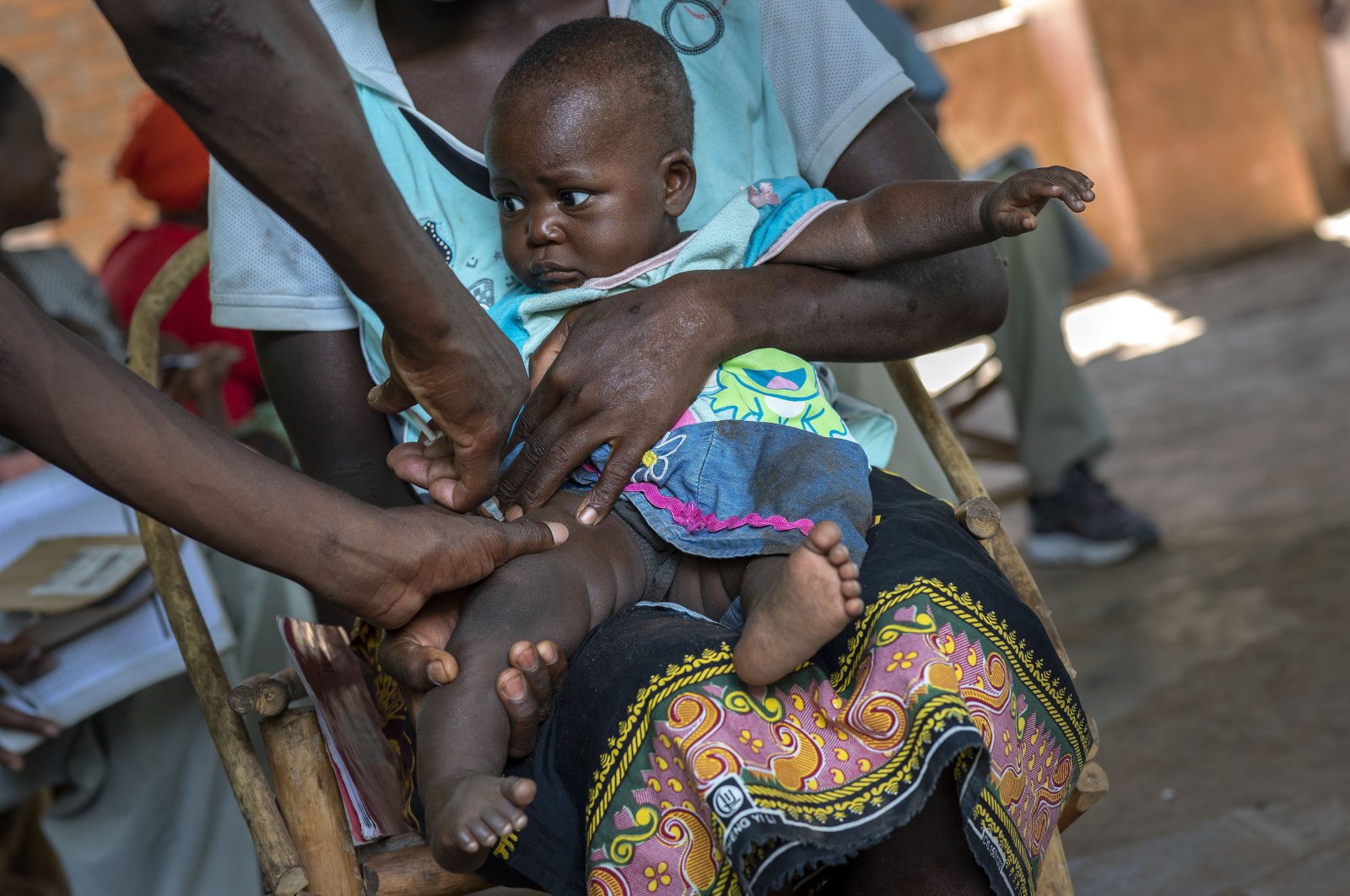A baby from the Malawi village of Tomali is injected with the world's first vaccine against malaria in a pilot program, Dec. 11, 2019. (AP Photo)