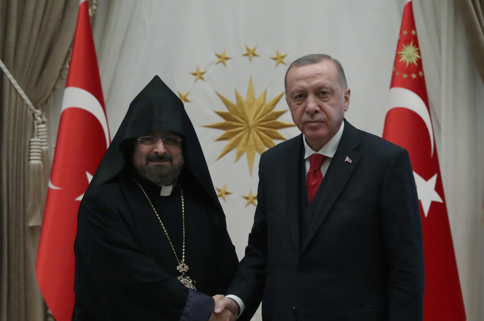President Recep Tayyip Erdoğan (right) shakes hands with Armenian Patriarch Sahak Maşalyan at the Presidential Complex in Ankara on January 15, 2020 (AA File Photo)
