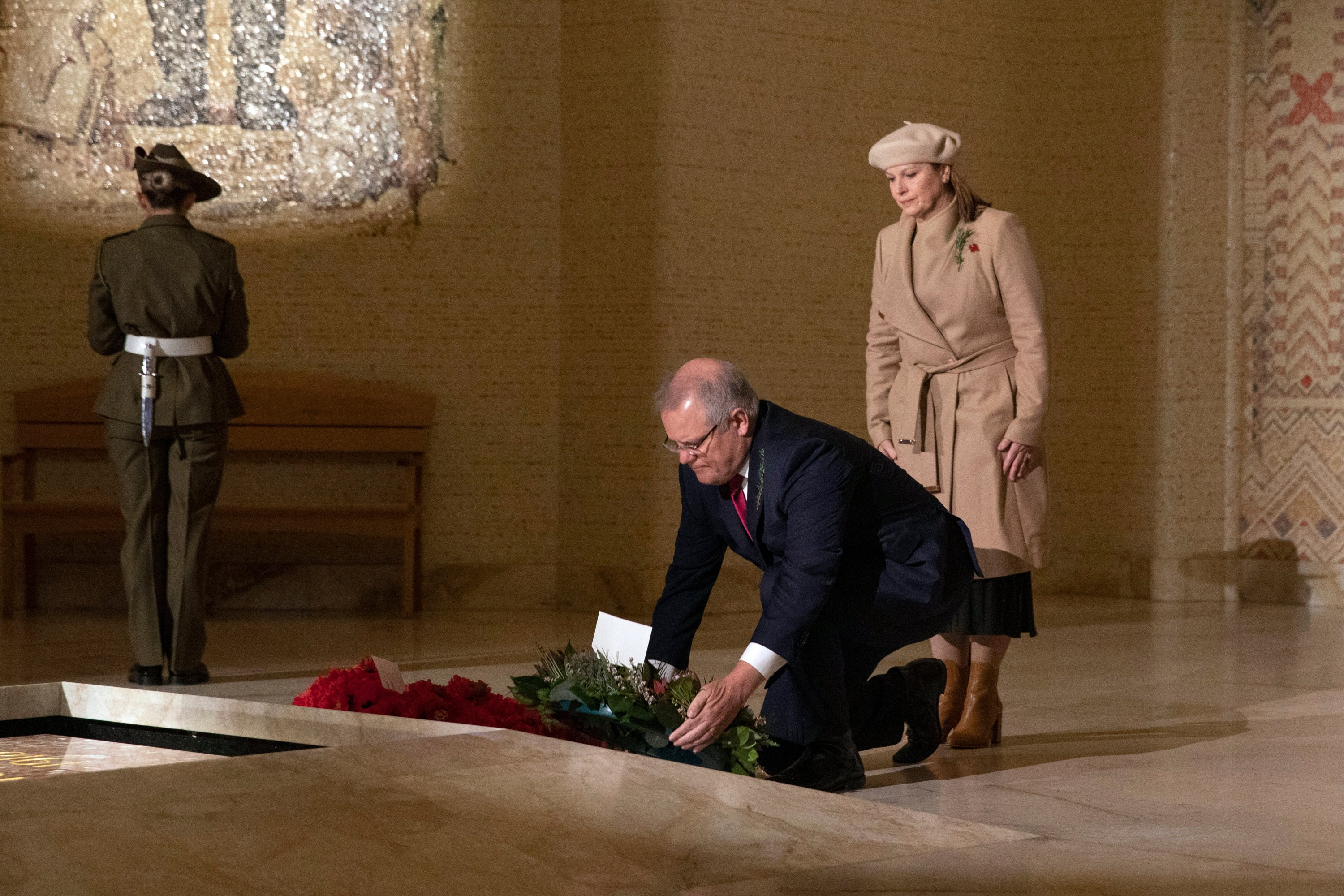 In this photo provided by Australian War Memorial, Australian Prime Minister Scott Morrison lays a wreath in the Hall of Memory during Anzac Day Commemorative Service at the Australian War Memorial in Canberra, Saturday, April 25, 2020. (Bob McKendry/Australian War Memorial via AP)