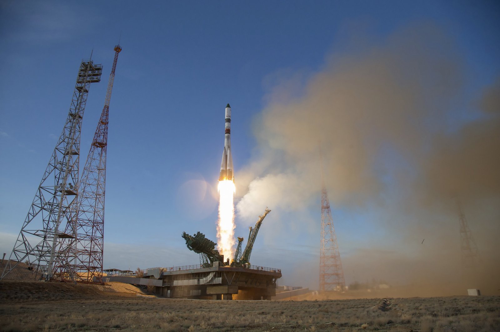 In this photo distributed by Roscosmos Space Agency Press Service, the Russian Progress MS-14 cargo spacecraft blasts off from the launch pad at Russia's space facility in Baikonur, Kazakhstan Saturday, April 25, 2020. (AP Photo)