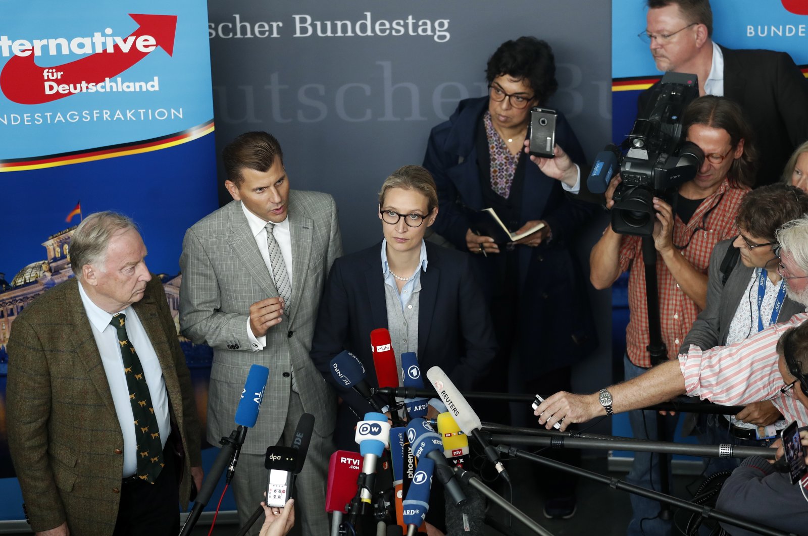 Christian Lueth (2nd from L), spokesman of the German right-wing populist party Alternative for Germany (AfD), and the co-top candidates for the general elections Alice Weidel (C) and Alexander Gauland (L) address the media prior to the first parliamentary group meeting of the party, in Berlin, Germany, Sept. 26, 2017. (EPA Photo)
