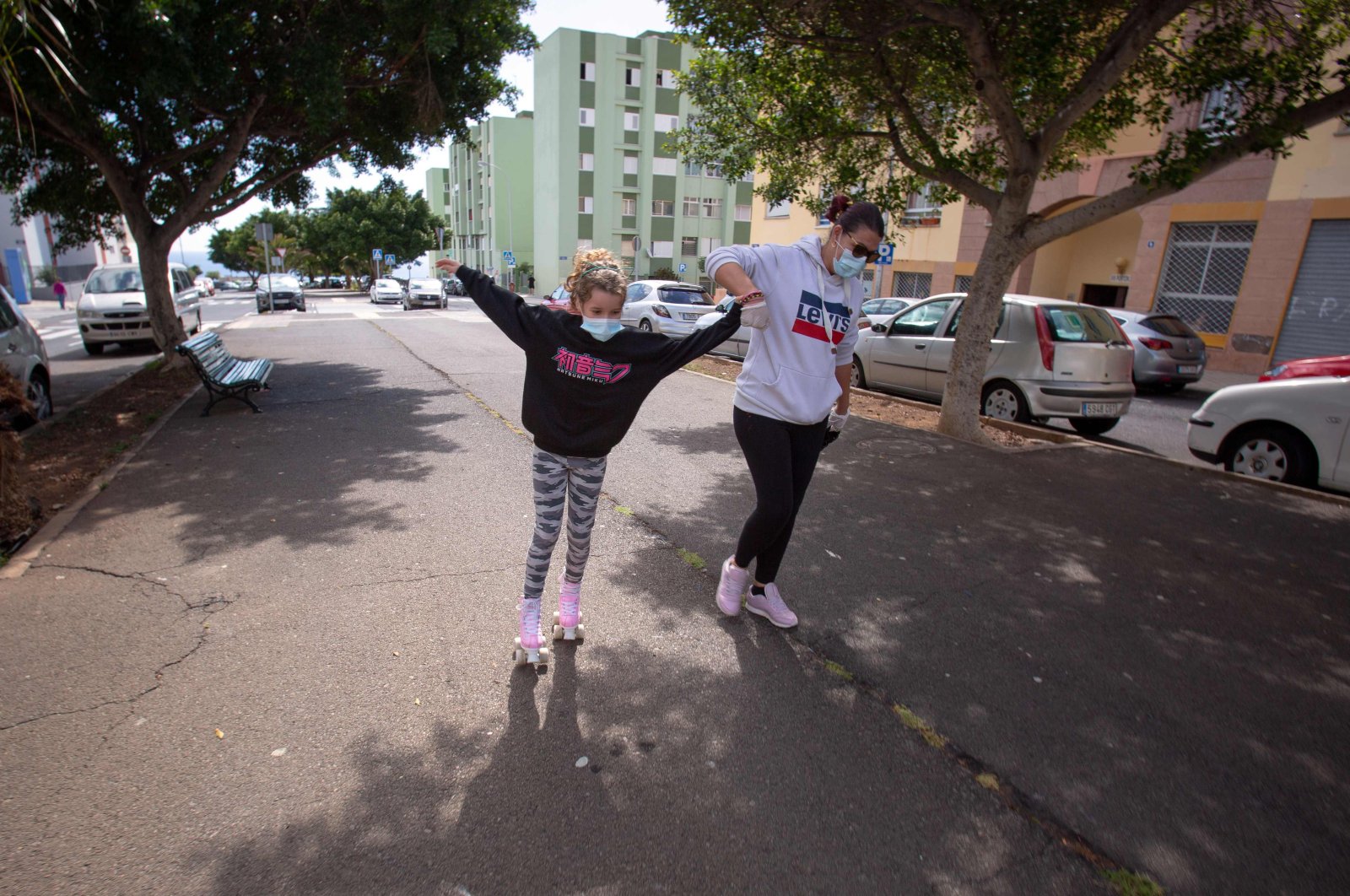 Vera, 10, is helped by her mother Rosi as she skates, during a national lockdown to prevent the spread of the COVID-19 disease, in Santa Cruz de Tenerife, Spain, April 26, 2020. (AFP Photo)