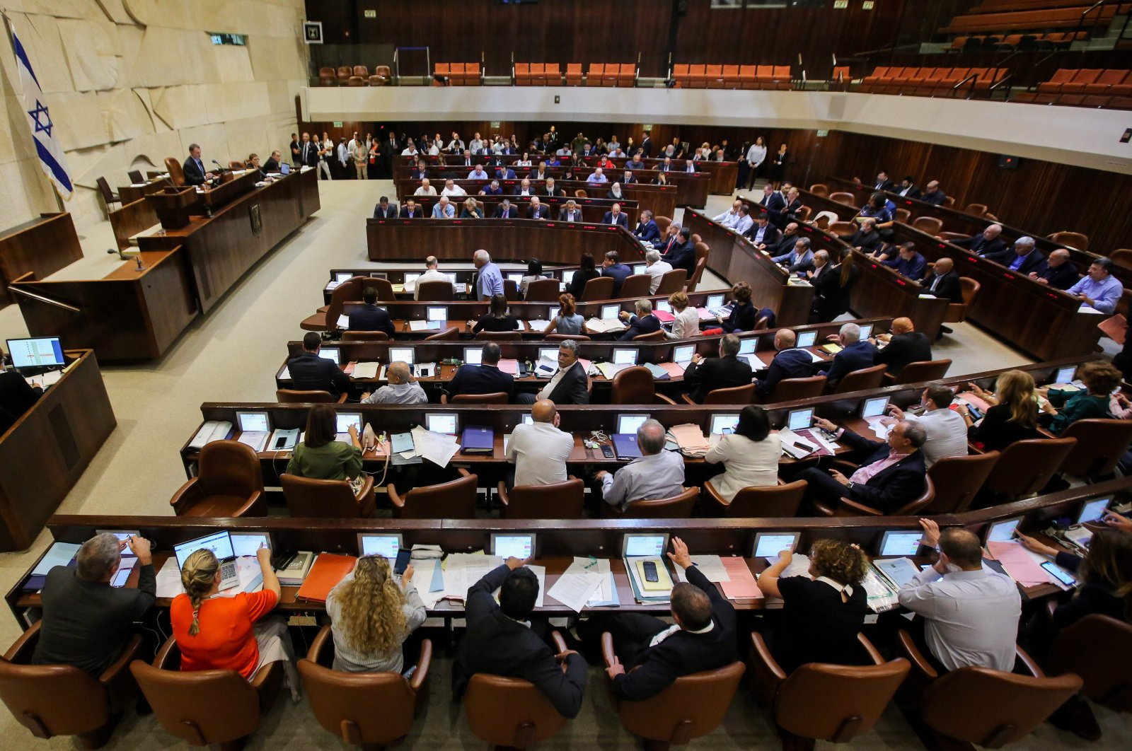 Israeli members of parliament attend the Knesset plenary hall session on July 18, 2018 (AFP File Photo)