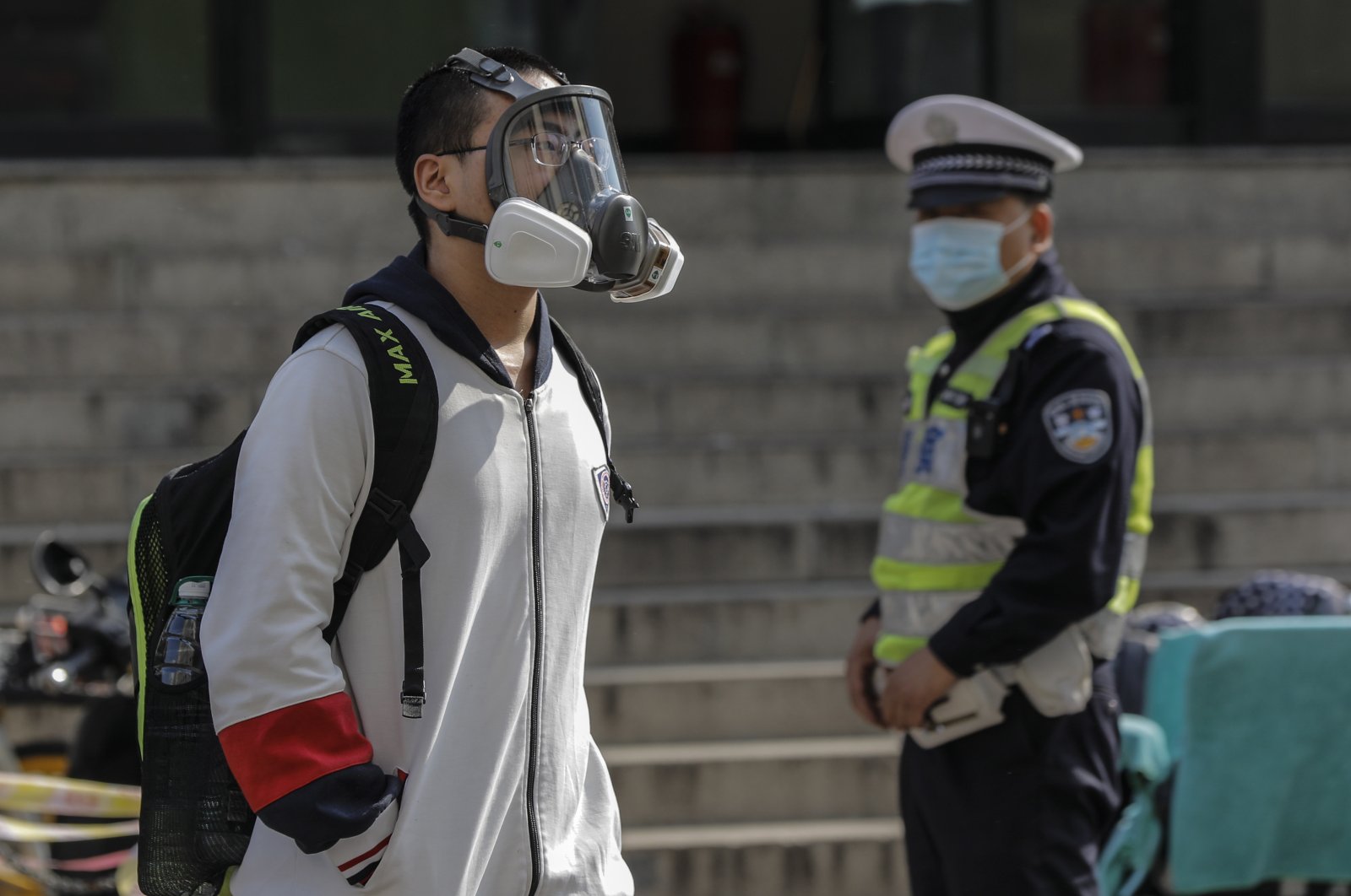 A student wearing a face mask leaves a high school in Beijing, China, 27 April 2020. Senior students in Beijing return to class for the first time after schools were closed down in January due to the outbreak of the coronavirus and COVID-19 disease. (EPA Photo)