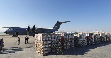 In this handout photo provided by the Turkish Defense Ministry, Turkish soldiers prepare to load a military cargo plane with Personal Protection Equipment donated by Turkey to help United States combat the new coronavirus outbreak, at the Etimesgut airport outside Ankara, Turkey, Tuesday, April 28, 2020. (AP Photo)