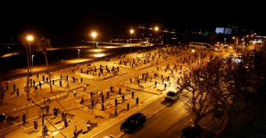 Muslim worshippers pray in an empty parking lot in the ancient Israeli port city of Jaffa for Ramadan prayers as mosques are closed due to the coronavirus pandemic, April 27, 2020. (Reuters Photo)