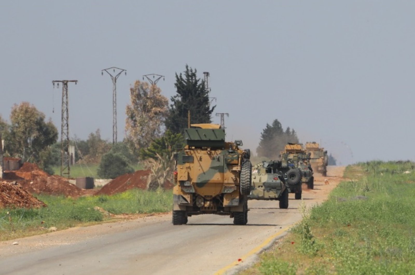 Turkey, Russia hold a sixth joint patrol on M4 highway with the participation of land, aerial elements, Idlib, Syria, April 28, 2020.  (DHA Photo)